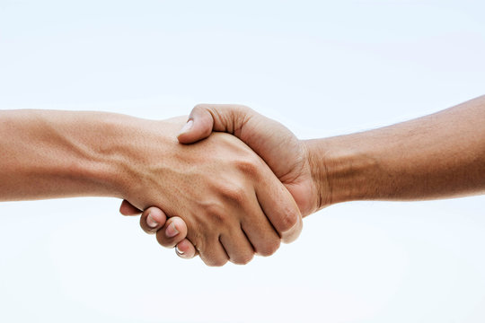 Two investors shaking hands on an agreement